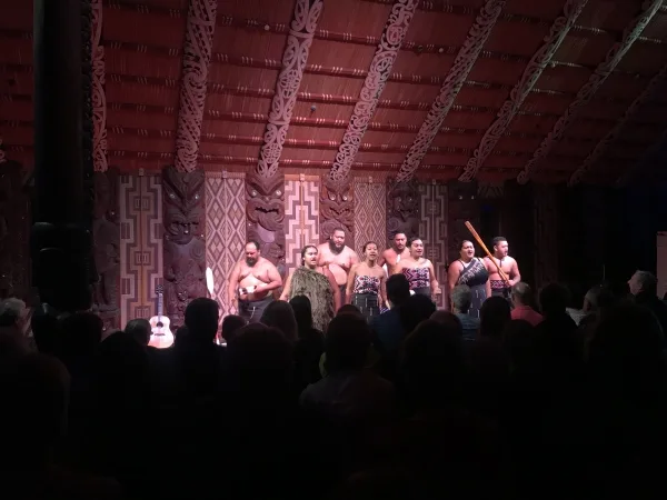 Performance from Nga Puhi singers and warriors for us audience members in their marae or community center.