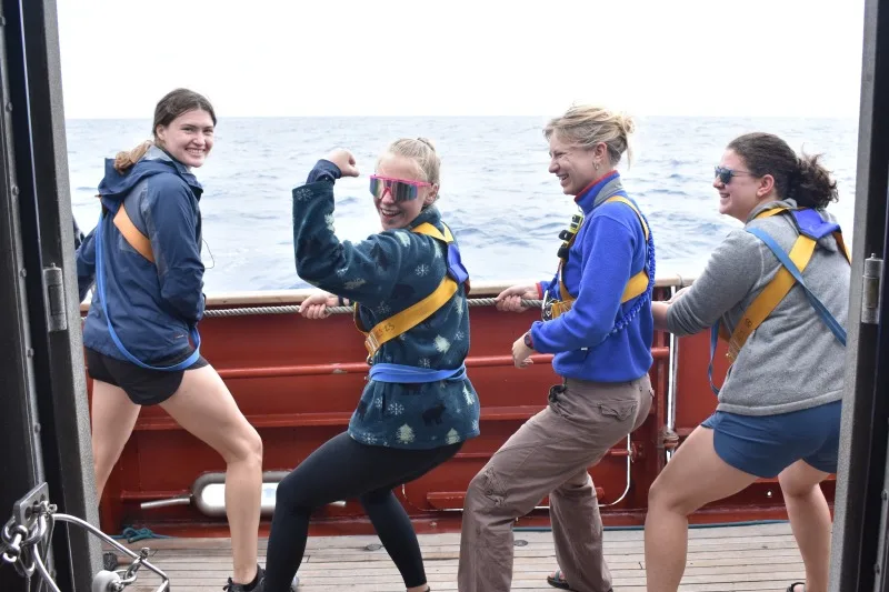 Left to right: Rikki, Lexi, Stella, and Ali setting a sail