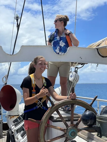 Katie at the helm, captain Allison has the con.