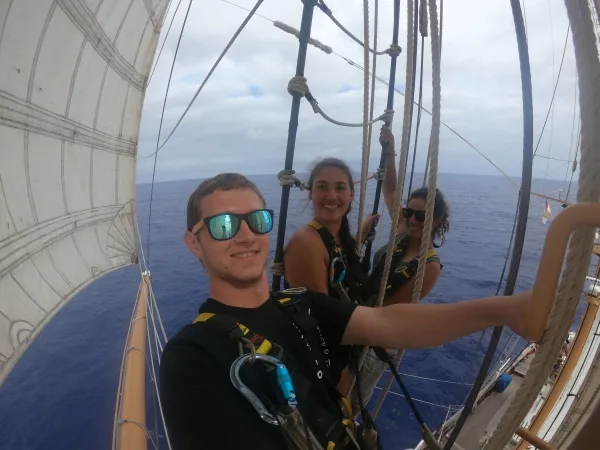 Aloft training with A-Watch (from left to right: Andrew, Leah, Allie) on the fighting top (lower platform on the foremast). Photo taken with much agility by Andrew in between the Tops'l flying back to rattle the mast!