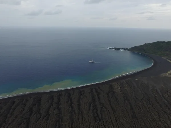 Drone image of Robert C. Seamans in Tonga, anchored near the world's newest island.