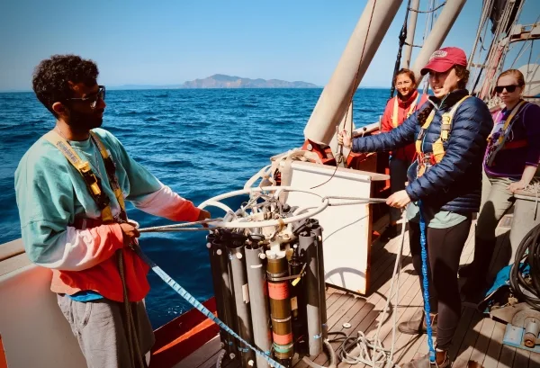 Mujahed and B watch deploying the carousel in the ocean.