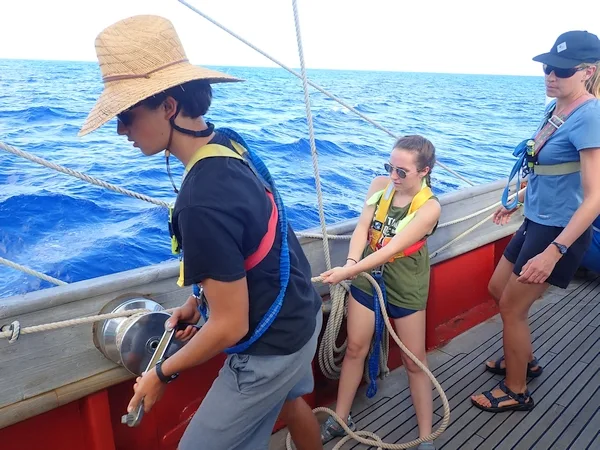 Here I am trimming the Fish Sheet with the assistance of Sam and getting commands from Carolyn;