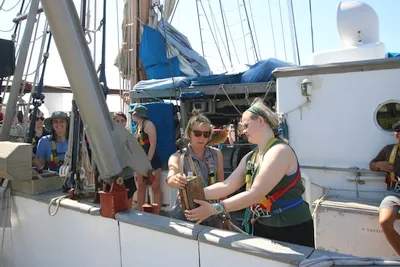 Julia learns how to 'dance' with the science equipment with the help of First Scientist Anna. Izzy is doing her part by driving the hydrowinch controls