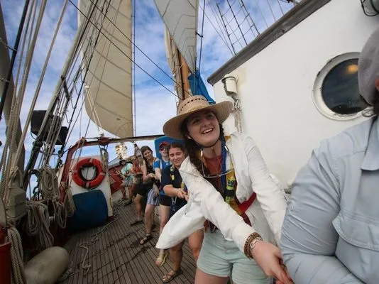 hauling on the mainsail halyard