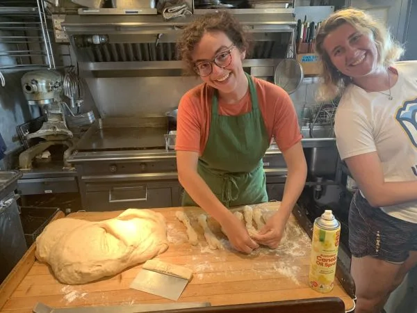 Braiding challah with Melia in the galley