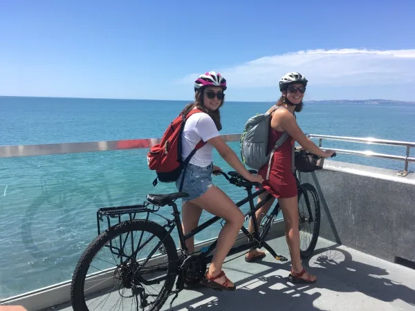 Natalie and Jessie, the birthday girl, on a sunny bike ride along the coast.