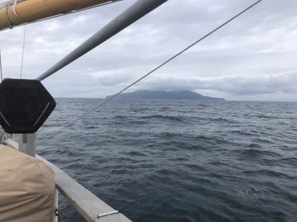 Sailing with Little Barrier Island off our starboard side.