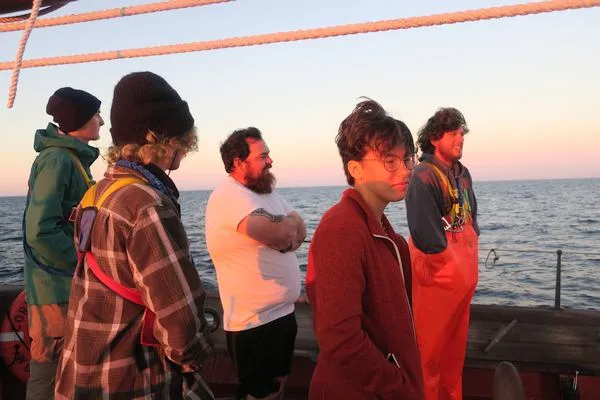 Students and Staff Illuminated by the Sunset